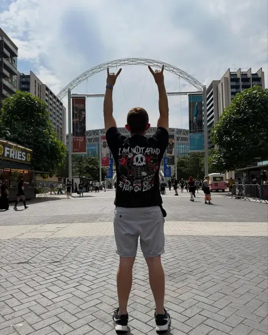 @elderemoaimz wearing the Not Afraid tee, at Wembley